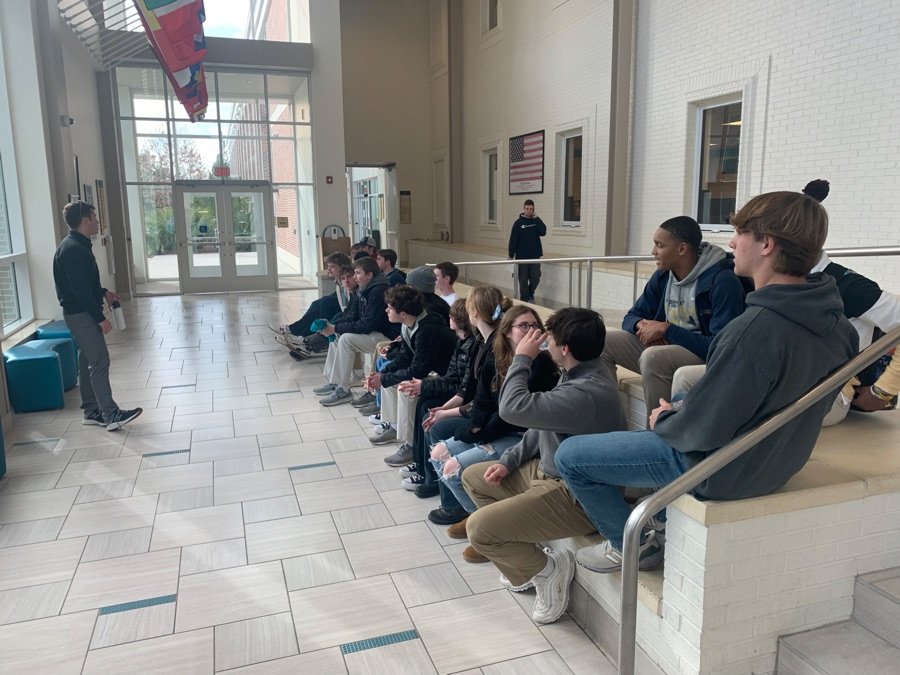 College tour students in hall